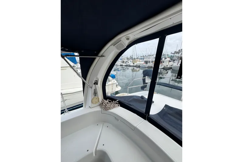 Slide: The Image of Interior view of 1999 Hunter Passage 420 sailboat in marina setting. - 21