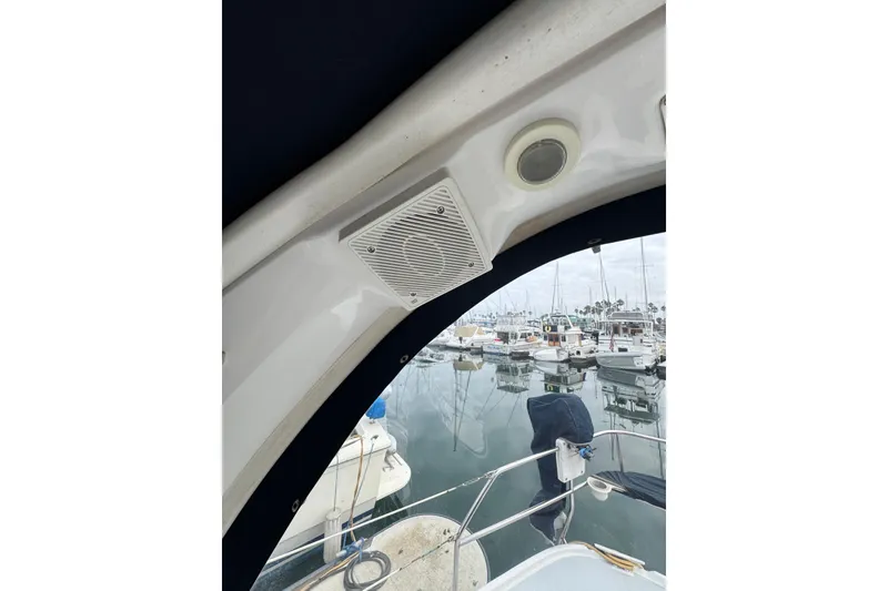 Slide: The Image of 1999 Hunter Passage 420 sailboat interior with marina view, featuring speaker and light. - 22