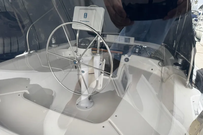 Slide: The Image of Steering wheel and navigation equipment on 1999 Hunter Passage 420 sailboat. - 23