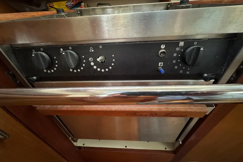 Slide: The Image of Oven controls on 1999 Hunter Passage 420 yacht, featuring Force 10 Marine branding. - 37