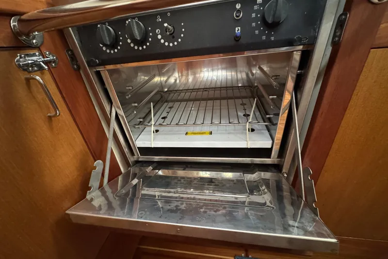 Slide: The Image of Stainless steel oven inside a 1999 Hunter Passage 420 yacht kitchen. - 38
