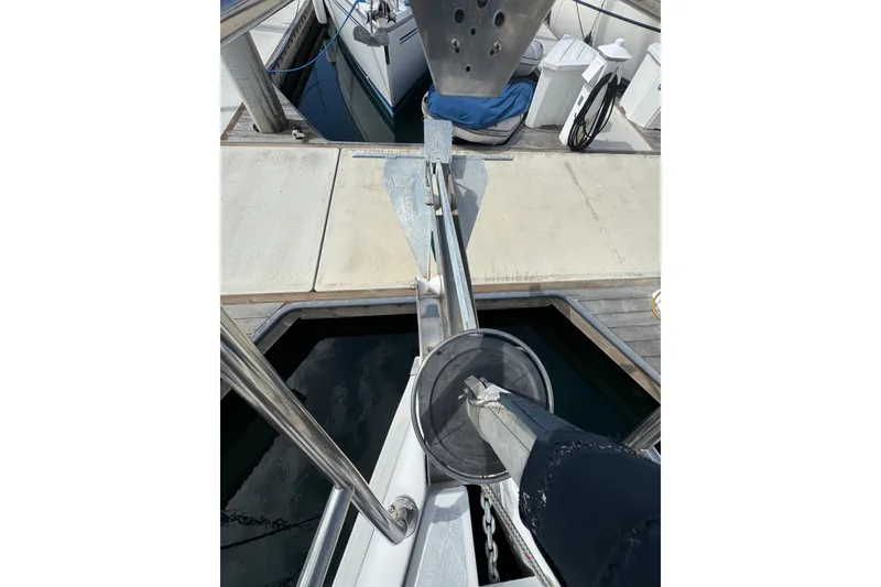 Slide: The Image of Bow view of a 1999 Hunter Passage 420 sailboat at a dock. - 4