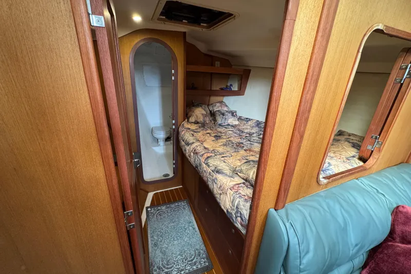 Slide: The Image of 1999 Hunter Passage 420 yacht interior with cozy bedroom and compact bathroom. - 44