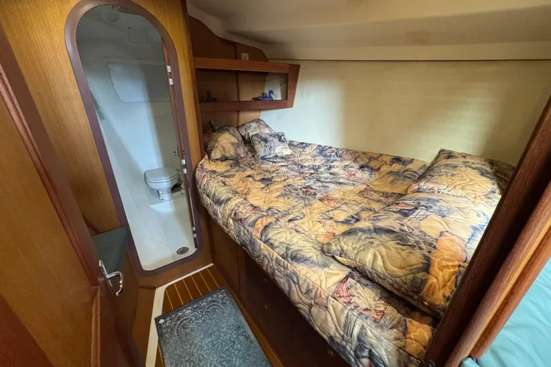 Slide: The Image of 1999 Hunter Passage 420 yacht cabin with bed and private bathroom. - 45