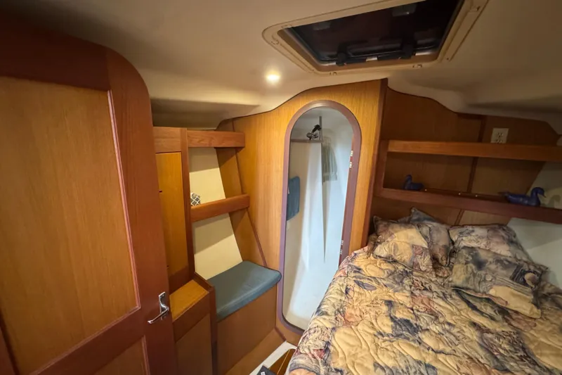 Slide: The Image of 1999 Hunter Passage 420 yacht interior with cozy cabin and wooden furnishings. - 46