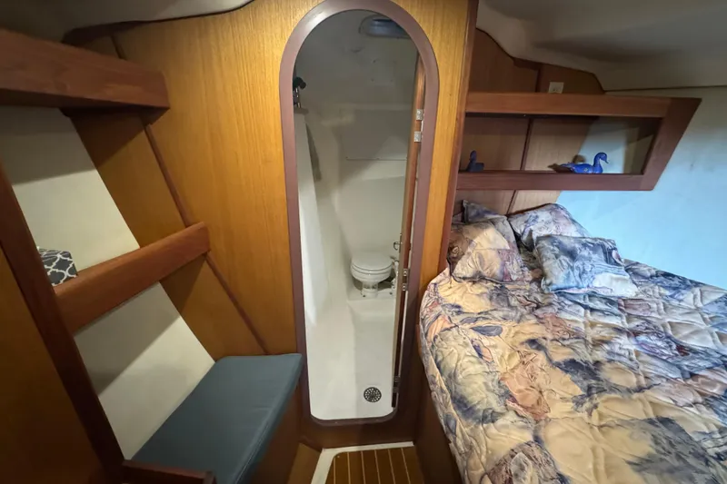 Slide: The Image of 1999 Hunter Passage 420 yacht interior with cozy bed and compact bathroom. - 47