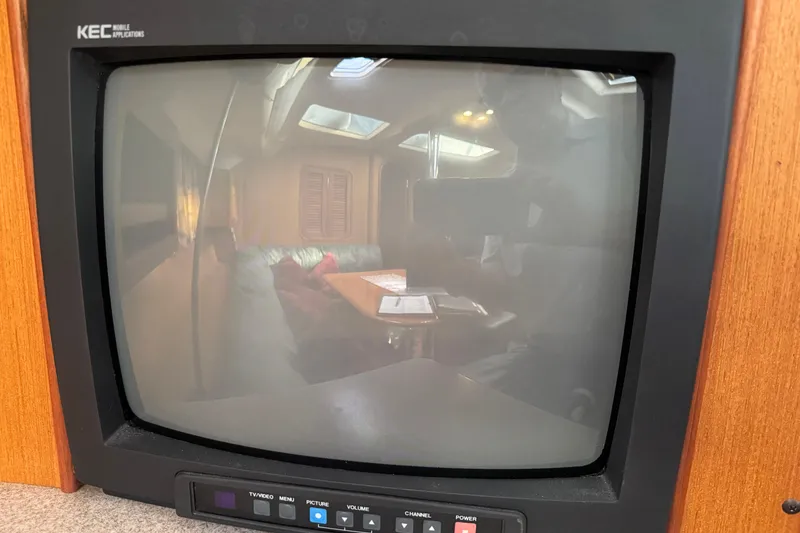 Slide: The Image of Reflection on vintage TV screen inside 1999 Hunter Passage 420 yacht cabin. - 51