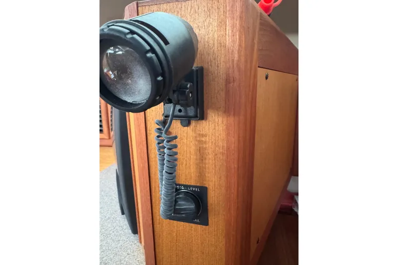 Slide: The Image of Close-up of a 1999 Hunter Passage 420 interior light fixture and audio control. - 57