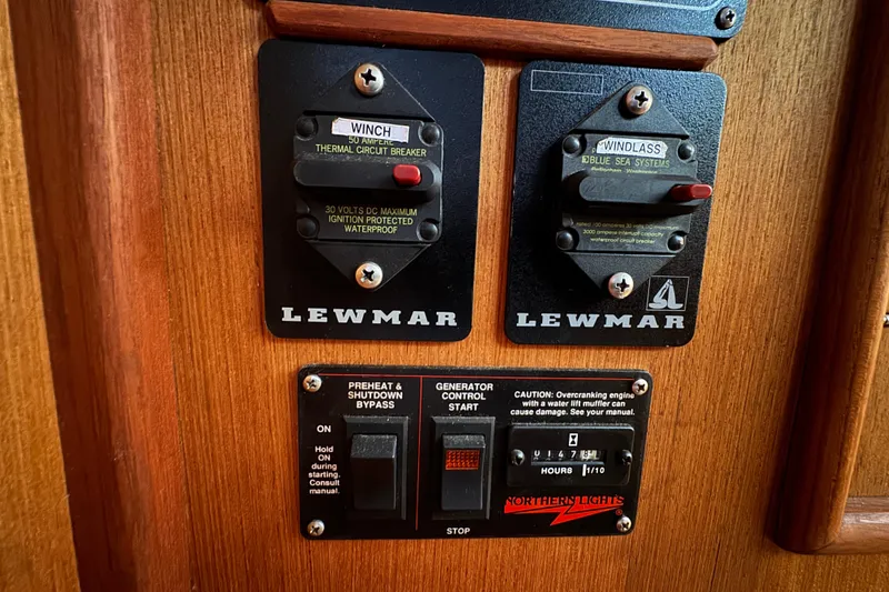 Slide: The Image of Control panel on a 1999 Hunter Passage 420 sailboat with Lewmar switches. - 61