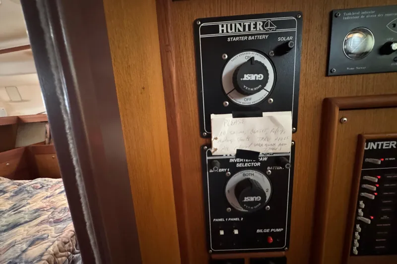 Slide: The Image of Control panel of a 1999 Hunter Passage 420 sailboat with handwritten note. - 62