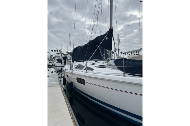 Slide: The Image of Sailboat docked at marina, 1999 Hunter Passage 420, overcast sky. - 7