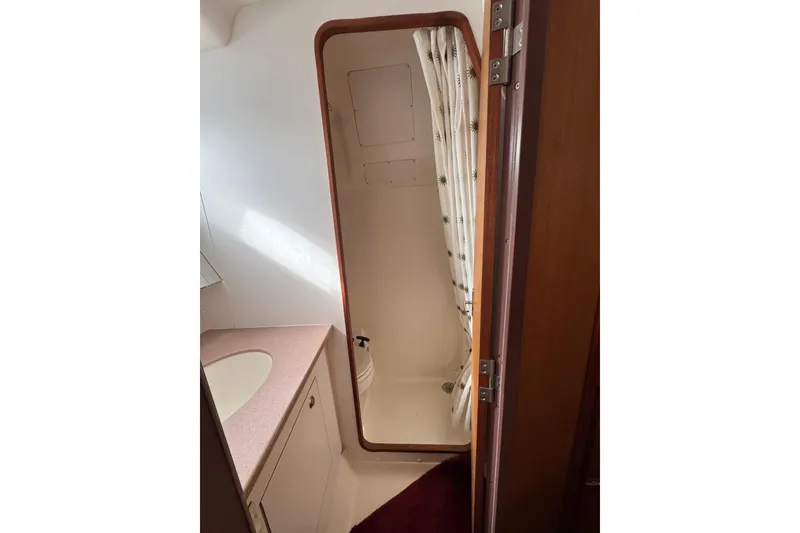 Slide: The Image of 1999 Hunter Passage 420 yacht bathroom with shower and sink. - 70