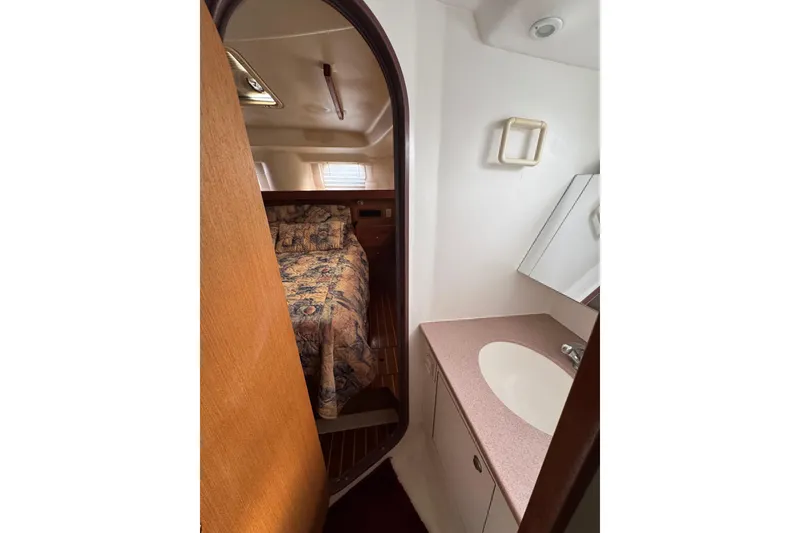 Slide: The Image of Interior of 1999 Hunter Passage 420 yacht showing cabin and bathroom area. - 72