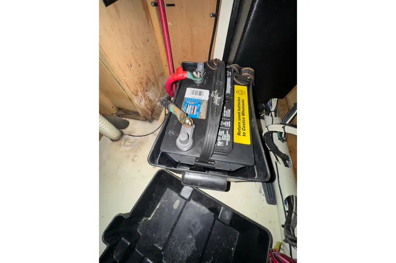 Slide: The Image of Battery compartment of a 1999 Hunter Passage 420 sailboat, showing wiring and connections. - 75