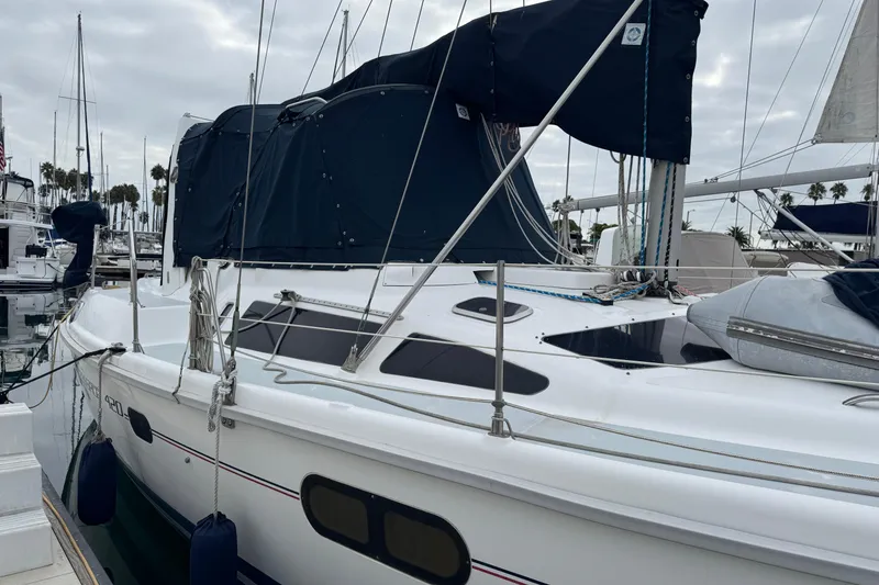 Slide: The Image of Sailboat Hunter Passage 420, 1999 model, docked at marina with overcast sky. - 8