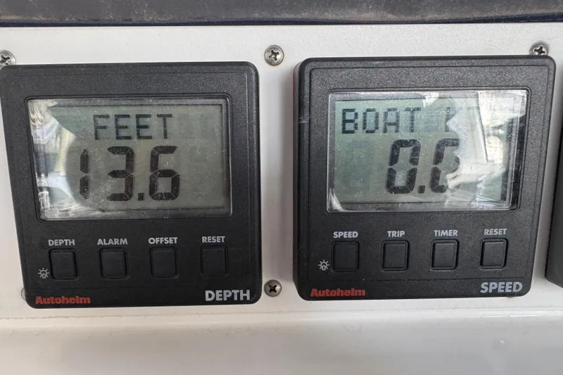 Slide: The Image of Depth and speed gauges on a 1999 Hunter Passage 420 sailboat, showing 13.6 feet depth. - 83