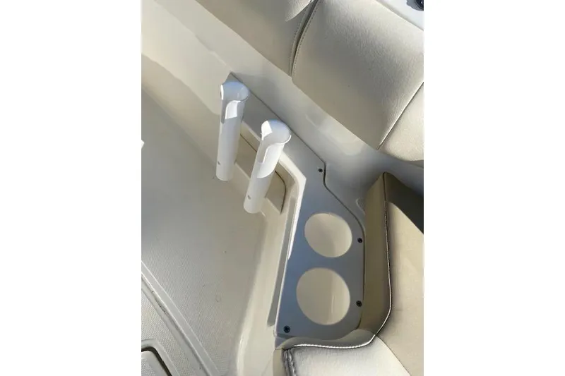 Slide: The Image of Interior of 2021 Boston Whaler 230 Outrage boat with cup holders and rod holders. - 12