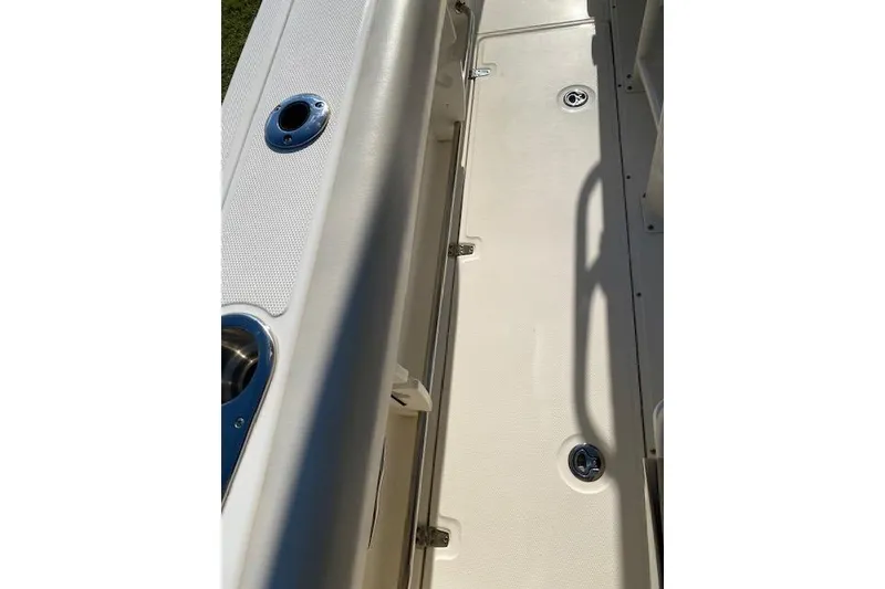 Slide: The Image of 2021 Boston Whaler 230 Outrage boat deck with stainless steel fixtures. - 21