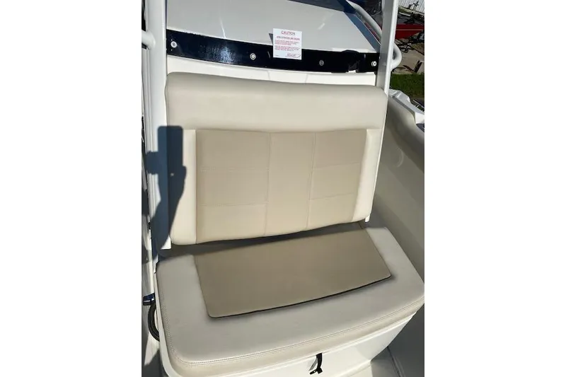 Slide: The Image of 2021 Boston Whaler 230 Outrage boat seat with beige upholstery. - 32