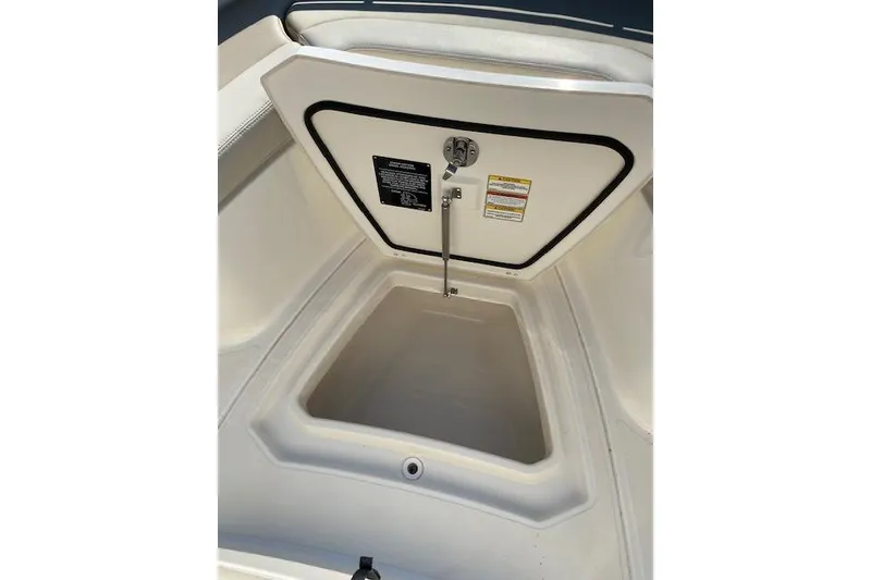 Slide: The Image of Open storage compartment on a 2021 Boston Whaler 230 Outrage boat. - 34