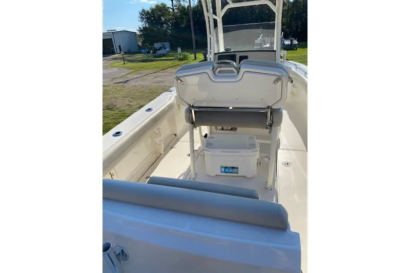Slide: The Image of 2021 Boston Whaler 230 Outrage boat interior with seating and storage. - 36