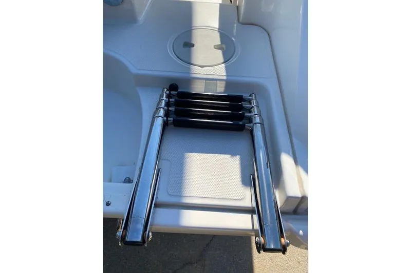 Slide: The Image of Folded ladder on a 2021 Boston Whaler 230 Outrage boat deck. - 37