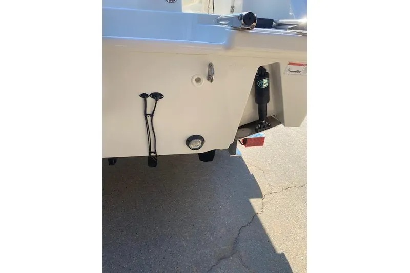 Slide: The Image of 2021 Boston Whaler 230 Outrage boat stern detail with trim tabs and fittings. - 4