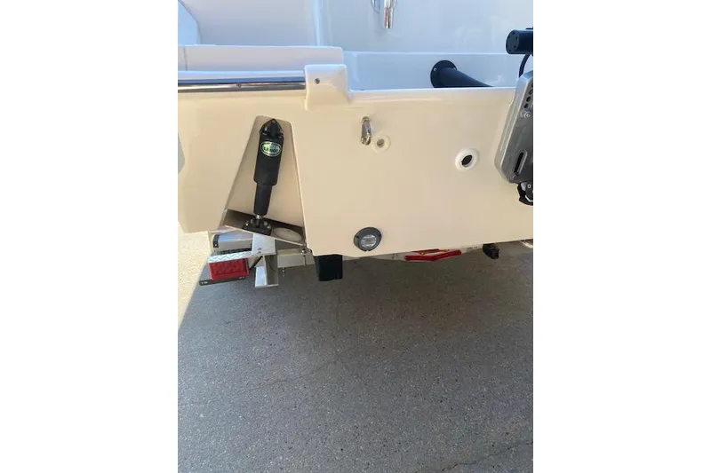 Slide: The Image of Rear view of 2021 Boston Whaler 230 Outrage boat on trailer. - 5