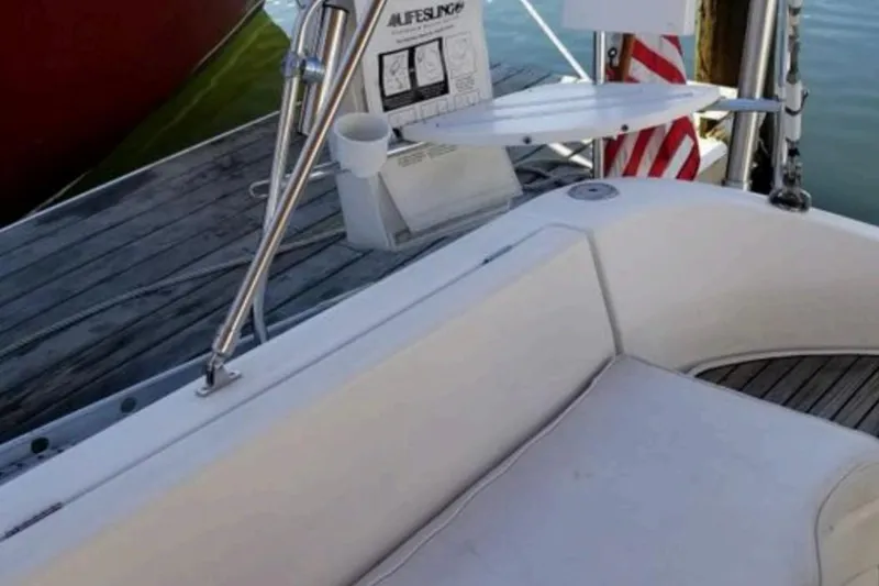 Slide: The Image of Cockpit view of a 1998 Beneteau Oceanis 352 sailboat, featuring seating and deck details. - 15