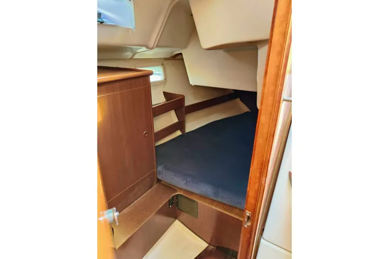 Slide: The Image of Cozy cabin interior of 1998 Beneteau Oceanis 352 sailboat with wooden furnishings. - 19