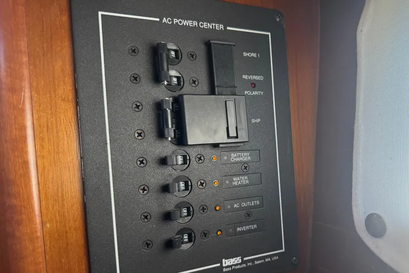 Slide: The Image of AC power center panel on 1998 Beneteau Oceanis 352 sailboat. - 23
