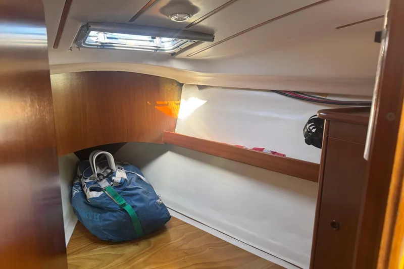 Slide: The Image of Interior cabin of 1998 Beneteau Oceanis 352 sailboat with storage bag and wooden finish. - 33