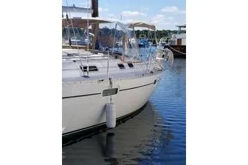 Slide: The Image of 1998 Beneteau Oceanis 352 sailboat docked in a marina, clear skies, calm water. - 5