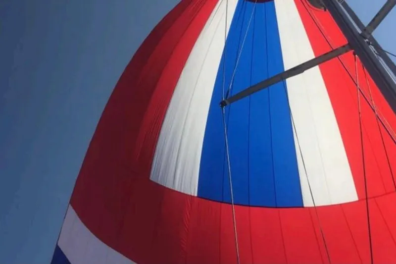 Slide: The Image of Colorful sail of a 1998 Beneteau Oceanis 352 yacht against a clear sky. - 6
