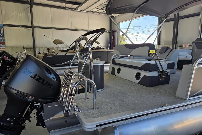 Slide: The Image of 2026 Avalon LSZ 2185 Cruise Rear Bench pontoon boat with Suzuki engine in showroom. - 4