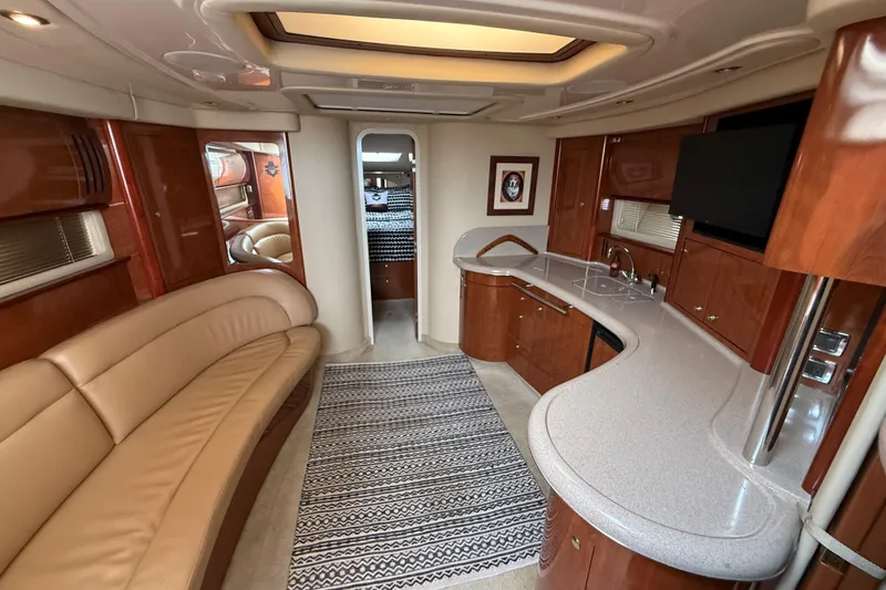 Slide: The Image of Luxurious interior of 2003 Sea Ray 420 Sundancer yacht with modern amenities and elegant design. - 32