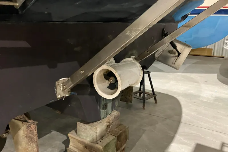 Slide: The Image of 2003 Sea Ray 420 Sundancer boat propeller and hull on dry dock. - 11