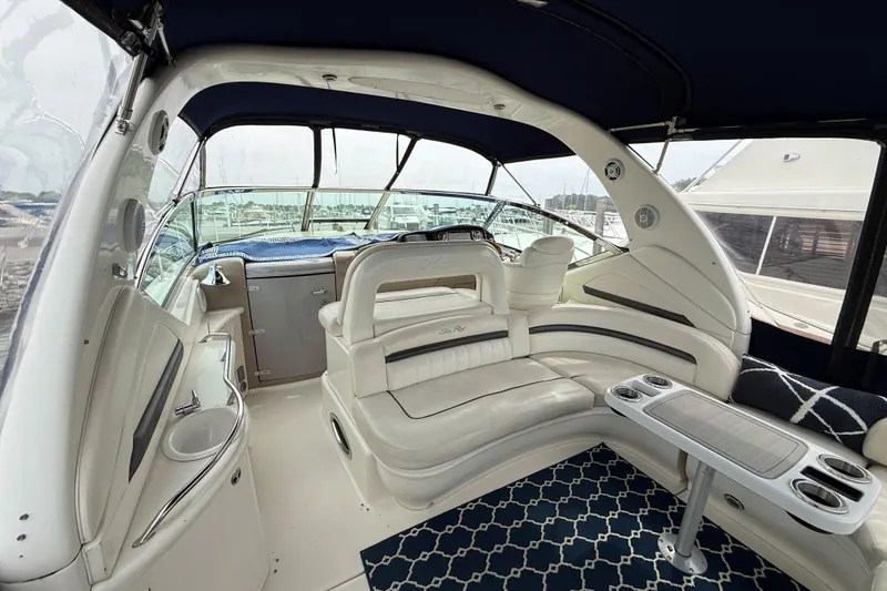 Slide: The Image of Interior of 2003 Sea Ray 420 Sundancer yacht with luxurious seating and elegant design. - 20