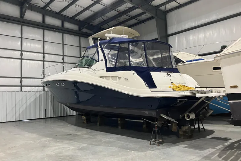 Slide: The Image of 2003 Sea Ray 420 Sundancer yacht in indoor storage facility. - 8