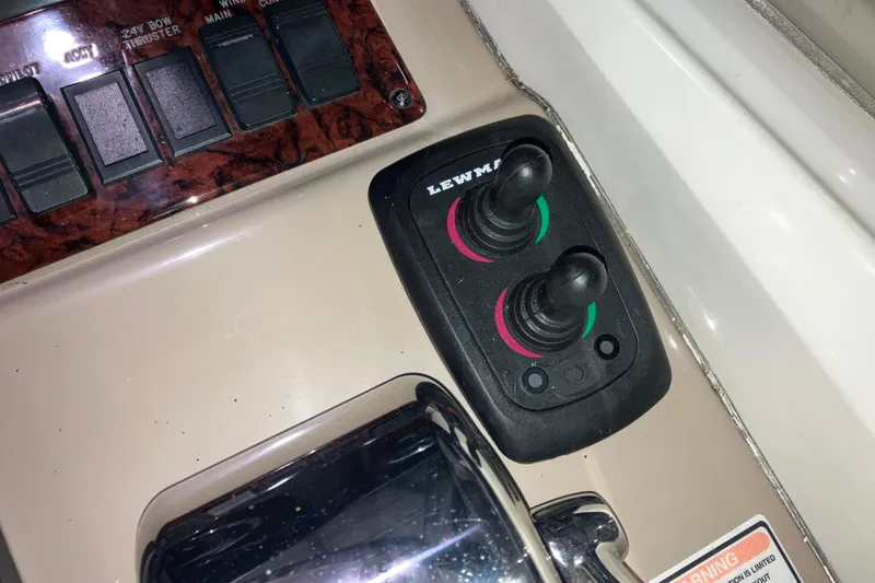 Slide: The Image of Control panel of a 2003 Sea Ray 420 Sundancer boat with Lewmar joysticks. - 31
