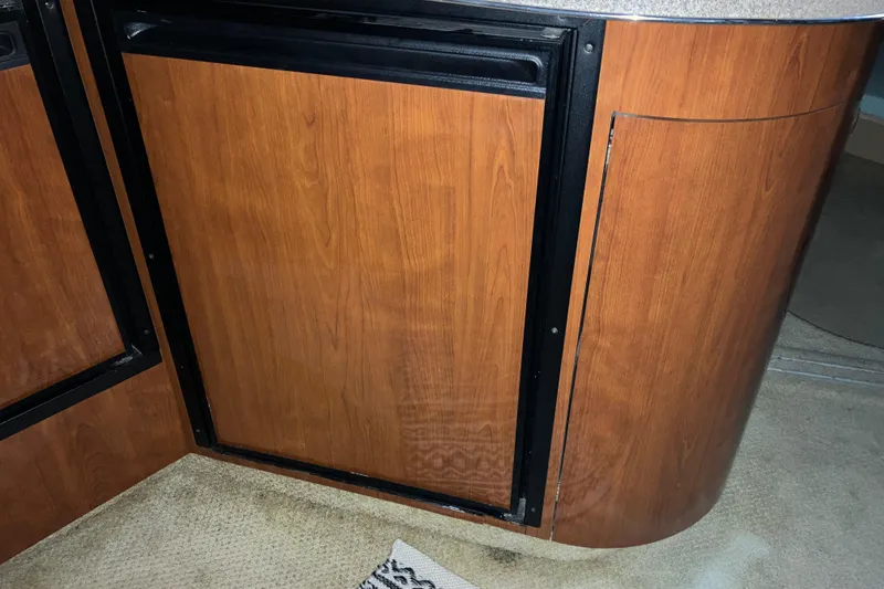 Slide: The Image of Wooden cabinetry inside a 2003 Sea Ray 420 Sundancer yacht interior. - 43
