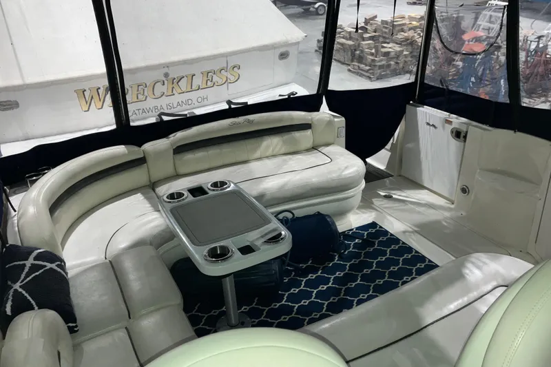 Slide: The Image of Luxurious interior of 2003 Sea Ray 420 Sundancer yacht with plush seating and table. - 22