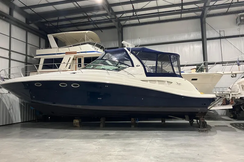 Slide: The Image of 2003 Sea Ray 420 Sundancer yacht in indoor storage facility. - 9