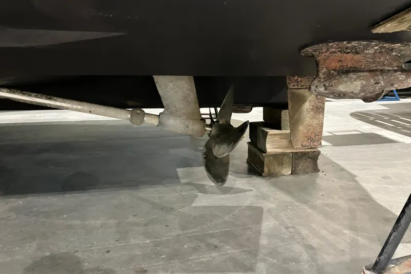 Slide: The Image of 2003 Sea Ray 420 Sundancer propeller and shaft on dry dock. - 12