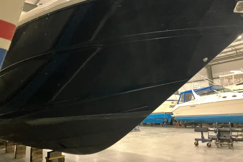 Slide: The Image of 2003 Sea Ray 420 Sundancer boat hull in storage facility. - 17