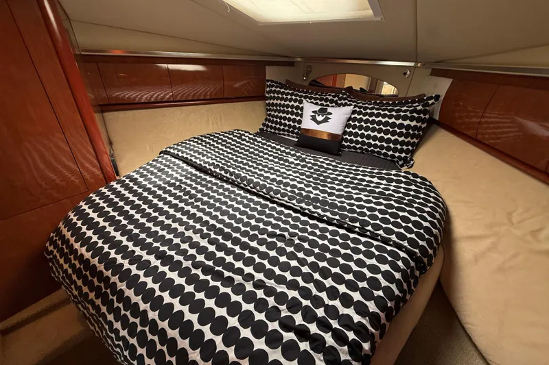 Slide: The Image of Luxurious cabin interior of 2003 Sea Ray 420 Sundancer with stylish bedding. - 37