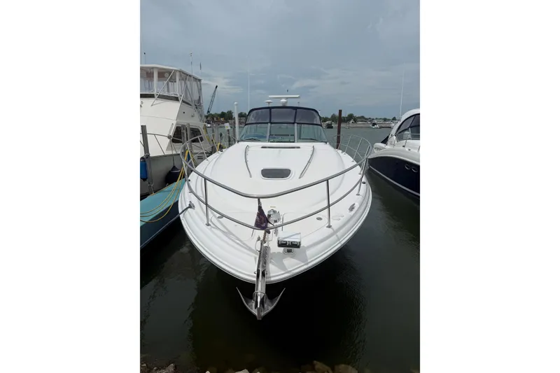 Slide: The Image of 2003 Sea Ray 420 Sundancer yacht docked at marina, front view. - 5