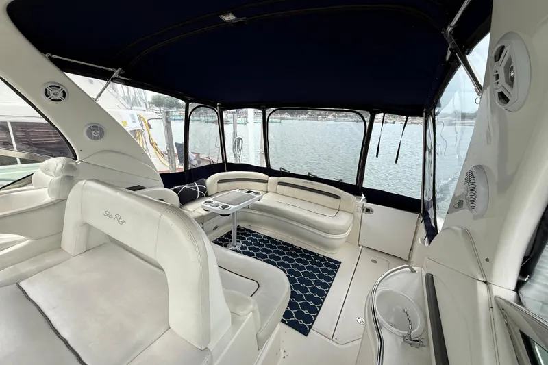 Slide: The Image of Luxurious interior of 2003 Sea Ray 420 Sundancer yacht with comfortable seating and scenic water view. - 23