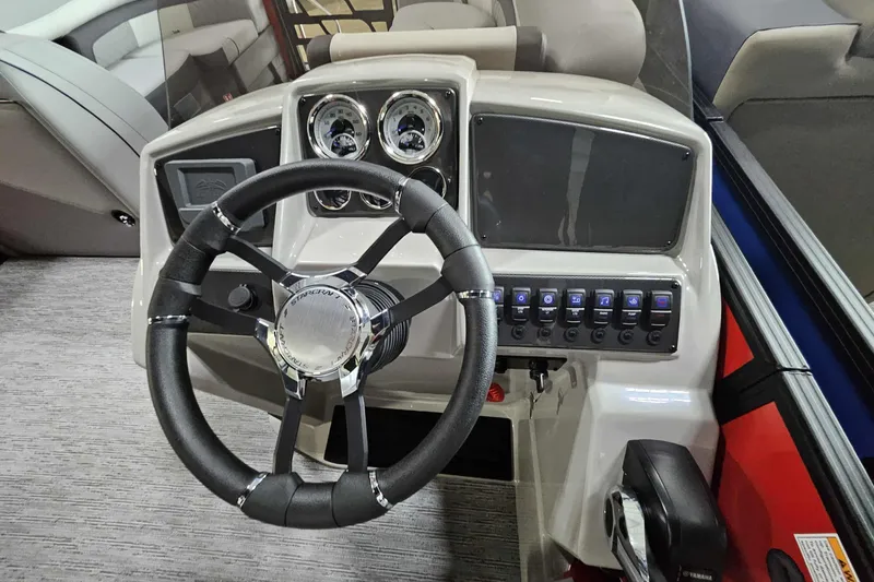Slide: The Image of 2026 Starcraft EXS 3 boat dashboard with steering wheel and control panel. - 6