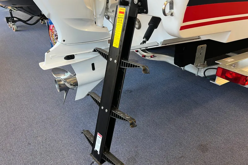 Slide: The Image of 2025 Pursuit DC 246 Dual Console boat with ladder and propeller detail. - 2